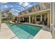 Stunning backyard pool and patio area, perfect for entertaining and enjoying outdoor living at 10646 Cory Lake Dr, Tampa, FL 33647