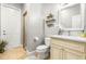 Clean bathroom featuring a walk-in shower, tile flooring, and modern vanity at 10724 Cory Lake Dr, Tampa, FL 33647