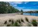 Community beach with a playground, calm waters, and clear skies in this lovely neighborhood at 10724 Cory Lake Dr, Tampa, FL 33647