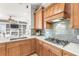 Close-up of the kitchen area with a stainless steel gas range and custom cabinetry at 10724 Cory Lake Dr, Tampa, FL 33647