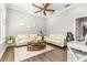 Bright office with a ceiling fan, wood floors, diplomas and a small table with chairs at 10724 Cory Lake Dr, Tampa, FL 33647
