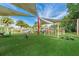 Community playground with padded turf, shade structures, climbing structures, and slides at 10724 Cory Lake Dr, Tampa, FL 33647