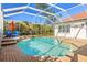 Sparkling private pool with a waterfall feature and plenty of space for relaxing and entertaining at 10724 Cory Lake Dr, Tampa, FL 33647