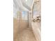 Walk-in shower features dual shower heads, tile surround, and arched windows at 10724 Cory Lake Dr, Tampa, FL 33647