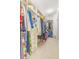 Spacious walk-in closet with custom built-ins and ample storage for clothing and accessories at 10724 Cory Lake Dr, Tampa, FL 33647