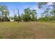 Expansive backyard with mature trees and plenty of room to relax at 11225 Flower Ave, Weeki Wachee, FL 34613