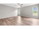 Spacious bedroom with hardwood floors and two windows offering a bright airy feel at 11225 Flower Ave, Weeki Wachee, FL 34613