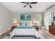 Charming main bedroom with a ceiling fan, stylish decor, and a comfortable, inviting ambiance at 11225 Flower Ave, Weeki Wachee, FL 34613