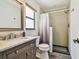Bathroom featuring a stylish vanity, ample natural light, and walk-in shower at 11628 Aspenwood Dr, New Port Richey, FL 34654
