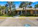 Inviting community clubhouse with ample parking, lush landscaping, and easy accessibility at 11813 Crawford Parrish Ln, Parrish, FL 34219
