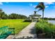 Path leading to community park gazebo overlooking a lake at 11813 Crawford Parrish Ln, Parrish, FL 34219