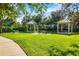 Community park featuring two gazebos, picnic tables, and well-manicured lawns at 11813 Crawford Parrish Ln, Parrish, FL 34219