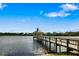 Community pier and gazebo on a lake, inviting relaxation and scenic views at 11813 Crawford Parrish Ln, Parrish, FL 34219