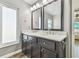 Elegant bathroom with double sinks and dark cabinetry at 12102 Steppingstone Blvd, Tampa, FL 33635