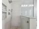 Modern bathroom with a shower and shelving at 12102 Steppingstone Blvd, Tampa, FL 33635