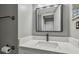 Modern bathroom vanity with white countertop and sleek faucet, complemented by stylish fixtures at 12102 Steppingstone Blvd, Tampa, FL 33635