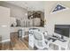 The open-concept home features a kitchen, breakfast bar, and workspace with stairs to a second floor at 12102 Steppingstone Blvd, Tampa, FL 33635
