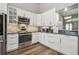 Beautiful kitchen with stainless steel appliances, marble backsplash, and plenty of cabinet space at 12102 Steppingstone Blvd, Tampa, FL 33635