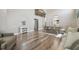 Bright and open-concept living area with hardwood floors, comfortable seating, and modern design at 12102 Steppingstone Blvd, Tampa, FL 33635