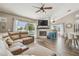 Open-concept living room with fireplace and bar seating at 12102 Steppingstone Blvd, Tampa, FL 33635