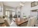 Spacious and well-lit living room with a large dining table, hardwood floors, and modern furnishings at 12102 Steppingstone Blvd, Tampa, FL 33635