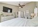 Bright main bedroom with a dresser, work space and vaulted ceiling at 12102 Steppingstone Blvd, Tampa, FL 33635