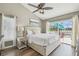 Relaxing main bedroom with a king bed and a view of the pool at 12102 Steppingstone Blvd, Tampa, FL 33635