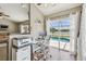 Bright home office with a view of the pool and a nearby lake offers a peaceful workspace at 12102 Steppingstone Blvd, Tampa, FL 33635