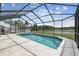 The screened in pool has a lake view and spa at 12102 Steppingstone Blvd, Tampa, FL 33635