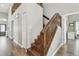 Hardwood staircase leading to the upper level of the home at 12102 Steppingstone Blvd, Tampa, FL 33635