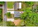 A close aerial view showcases the home's roof, patio area, and driveway at 1213 E Idlewild Ave, Tampa, FL 33604