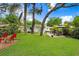 Spacious backyard featuring a hammock, seating, and patio furniture at 1213 E Idlewild Ave, Tampa, FL 33604