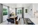 Bright dining room featuring hardwood floors, natural light, and seating for six at 1213 E Idlewild Ave, Tampa, FL 33604