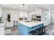Bright, modern eat-in kitchen with blue island and breakfast bar seating at 1213 E Idlewild Ave, Tampa, FL 33604