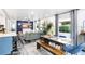 Open-concept living room and dining area features hardwood floors and lots of natural light at 1213 E Idlewild Ave, Tampa, FL 33604