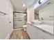 Modern bathroom featuring sleek white cabinets, a square sink, and glass shower at 12268 Country White Cir, Tampa, FL 33635