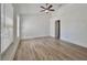 Spacious bedroom with natural light, neutral paint, and fan at 12268 Country White Cir, Tampa, FL 33635