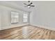 Bright bedroom with a ceiling fan and large windows, offering ample natural light at 12268 Country White Cir, Tampa, FL 33635