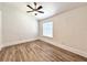 Large bedroom with new floors, ceiling fan and plenty of natural light at 12268 Country White Cir, Tampa, FL 33635