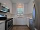 Fully equipped kitchen featuring stainless steel appliances and abundant cabinet space at 12268 Country White Cir, Tampa, FL 33635