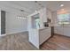 Modern living room with wood laminate floors and open to kitchen at 12268 Country White Cir, Tampa, FL 33635