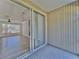 This patio has sliding glass doors to the living room and tile flooring at 12268 Country White Cir, Tampa, FL 33635