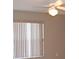 Bedroom with neutral paint, a ceiling fan, and a window with white blinds at 12488 Harper St, Spring Hill, FL 34609