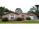 Charming single-story home with a well-manicured lawn and inviting curb appeal at 12488 Harper St, Spring Hill, FL 34609