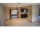Open concept living and dining area with lots of natural light and tile floors at 12488 Harper St, Spring Hill, FL 34609