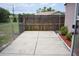 Concrete patio area surrounded by a wood fence at 12488 Harper St, Spring Hill, FL 34609