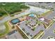 Aerial view of community amenities including a pool, tennis courts, clubhouse, and pond at 13014 Willow Grove Dr, Riverview, FL 33579