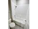 Clean bathroom with white tiled shower and tub combination, and neutral flooring at 13014 Willow Grove Dr, Riverview, FL 33579