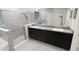Bathroom featuring a dual sink vanity with granite counters and a glass shower at 13014 Willow Grove Dr, Riverview, FL 33579