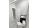 Cozy powder room featuring modern fixtures, granite countertop and grey ceramic floors at 13014 Willow Grove Dr, Riverview, FL 33579